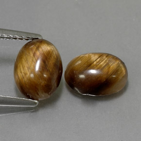 Tiger's Eye طبيعي بلون بني ذهبي، وزن ‎‎ قيراط، شكل بيضاوى، مقاس ‎8.8x6.8‎ مم