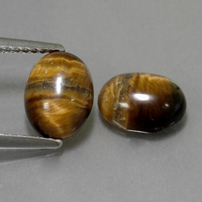 Tiger's Eye طبيعي بلون بني ذهبي، وزن ‎‎ قيراط، شكل بيضاوى، مقاس ‎8.8x6.8‎ مم