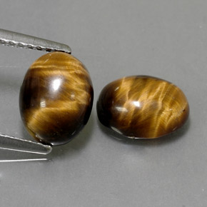 Tiger's Eye طبيعي بلون بني ذهبي، وزن ‎‎ قيراط، شكل بيضاوى، مقاس ‎8.8x6.8‎ مم