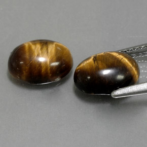 Tiger's Eye طبيعي بلون بني ذهبي، وزن ‎‎ قيراط، شكل بيضاوى، مقاس ‎8.9x7‎ مم