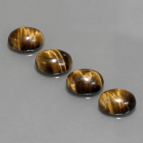 Tiger's Eye طبيعي بلون بني ذهبي، وزن ‎‎ قيراط، شكل بيضاوى، مقاس ‎8.9x6.9‎ مم