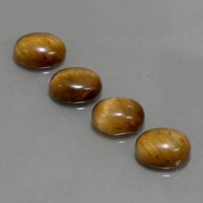 Tiger's Eye طبيعي بلون بني ذهبي، وزن ‎‎ قيراط، شكل بيضاوى، مقاس ‎8.9x6.9‎ مم