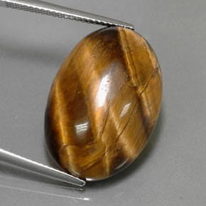 Tiger's Eye طبيعي بلون بني ذهبي، وزن ‎23.72‎ قيراط، شكل بيضاوى، مقاس ‎23.8x16.3‎ مم