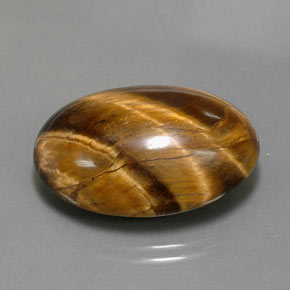 Tiger's Eye طبيعي بلون بني ذهبي، وزن ‎23.72‎ قيراط، شكل بيضاوى، مقاس ‎23.8x16.3‎ مم