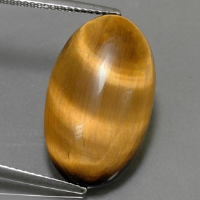 Tiger's Eye طبيعي بلون بني ذهبي، وزن ‎11.94‎ قيراط، شكل بيضاوى، مقاس ‎22.3x13.3‎ مم