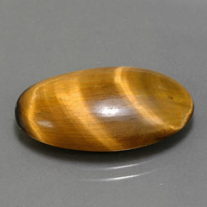 Tiger's Eye طبيعي بلون بني ذهبي، وزن ‎11.94‎ قيراط، شكل بيضاوى، مقاس ‎22.3x13.3‎ مم