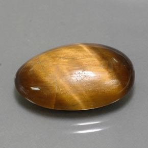 Tiger's Eye طبيعي بلون بني ذهبي، وزن ‎13.32‎ قيراط، شكل بيضاوى، مقاس ‎20.8x13.8‎ مم