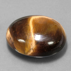 Tiger's Eye طبيعي بلون بني ذهبي، وزن ‎15.02‎ قيراط، شكل بيضاوى، مقاس ‎18.6x15‎ مم