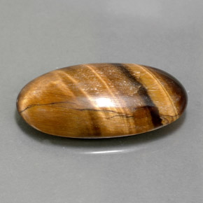 Tiger's Eye طبيعي بلون بني ذهبي، وزن ‎11.79‎ قيراط، شكل بيضاوى، مقاس ‎23.3x12.2‎ مم