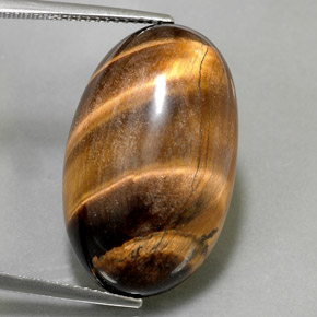 Tiger's Eye طبيعي بلون بني ذهبي، وزن ‎26.13‎ قيراط، شكل بيضاوى، مقاس ‎24.8x15.3‎ مم