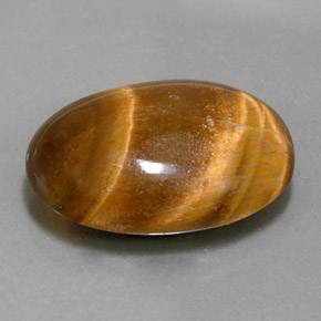 Tiger's Eye طبيعي بلون بني ذهبي، وزن ‎11.07‎ قيراط، شكل بيضاوى، مقاس ‎19.3x13.3‎ مم