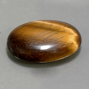 Tiger's Eye طبيعي بلون بني ذهبي، وزن ‎10.40‎ قيراط، شكل بيضاوى، مقاس ‎19.5x13.7‎ مم