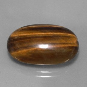 Tiger's Eye طبيعي بلون بني ذهبي، وزن ‎14.42‎ قيراط، شكل بيضاوى، مقاس ‎21.1x13.8‎ مم