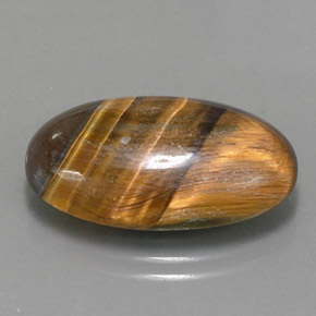 Tiger's Eye طبيعي بلون بني ذهبي، وزن ‎13.07‎ قيراط، شكل بيضاوى، مقاس ‎21.6x13‎ مم