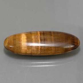 Tiger's Eye طبيعي بلون بني ذهبي، وزن ‎18.16‎ قيراط، شكل بيضاوى، مقاس ‎31.5x12.1‎ مم