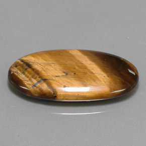 Tiger's Eye طبيعي بلون بني ذهبي، وزن ‎14.24‎ قيراط، شكل بيضاوى، مقاس ‎27.9x14.7‎ مم