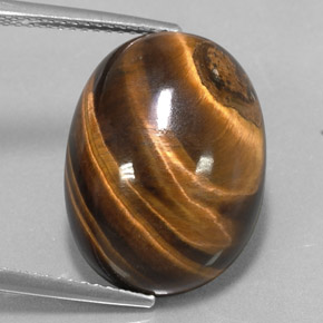 Tiger's Eye طبيعي بلون بني ذهبي، وزن ‎15.36‎ قيراط، شكل بيضاوى، مقاس ‎18.9x14‎ مم