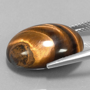 Tiger's Eye طبيعي بلون بني ذهبي، وزن ‎15.36‎ قيراط، شكل بيضاوى، مقاس ‎18.9x14‎ مم