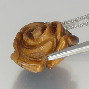 Tiger's Eye طبيعي بلون بنى متوسط، وزن ‎9.87‎ قيراط، شكل شكل خيالي، مقاس ‎14.6x13.7‎ مم