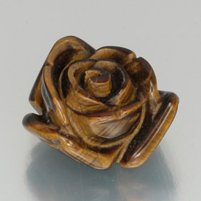 Tiger's Eye طبيعي بلون بني ذهبي، وزن ‎12.59‎ قيراط، شكل شكل خيالي، مقاس ‎16x14.5‎ مم