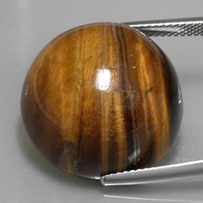 Tiger's Eye طبيعي بلون بني ذهبي، وزن ‎36.96‎ قيراط، شكل دائري، مقاس ‎20.12‎ مم
