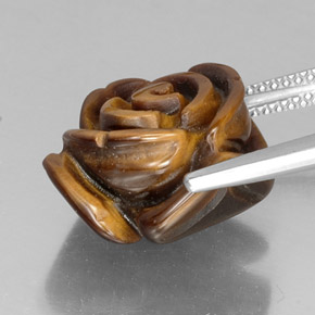 Tiger's Eye طبيعي بلون بني ذهبي، وزن ‎11.73‎ قيراط، شكل شكل خيالي، مقاس ‎15.3x14.7‎ مم
