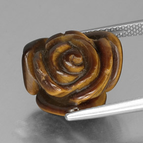 Tiger's Eye طبيعي بلون بني ذهبي، وزن ‎10.77‎ قيراط، شكل شكل خيالي، مقاس ‎15.2x14.7‎ مم