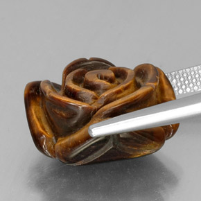 Tiger's Eye طبيعي بلون بني ذهبي، وزن ‎12.84‎ قيراط، شكل شكل خيالي، مقاس ‎16.1x15.8‎ مم