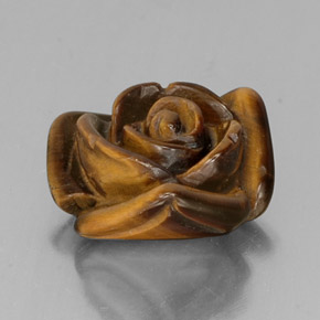 Tiger's Eye طبيعي بلون بني ذهبي، وزن ‎9.49‎ قيراط، شكل شكل خيالي، مقاس ‎15.4x14.9‎ مم