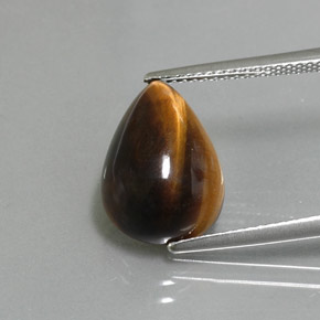 Tiger's Eye طبيعي بلون بني ذهبي، وزن ‎5.67‎ قيراط، شكل شكل الكمثرى، مقاس ‎14.2x10.2‎ مم