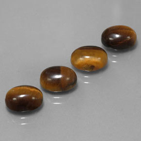 Tiger's Eye طبيعي بلون بني ذهبي، وزن ‎‎ قيراط، شكل بيضاوى، مقاس ‎9x7‎ مم