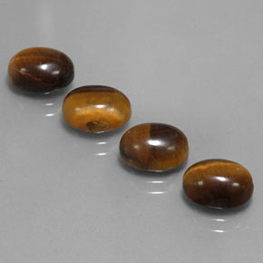 Tiger's Eye طبيعي بلون بني ذهبي، وزن ‎‎ قيراط، شكل بيضاوى، مقاس ‎9x7‎ مم