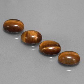 Tiger's Eye طبيعي بلون بني ذهبي، وزن ‎‎ قيراط، شكل بيضاوى، مقاس ‎9x7‎ مم