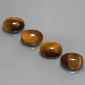 Tiger's Eye طبيعي بلون بني ذهبي، وزن ‎‎ قيراط، شكل بيضاوى، مقاس ‎9x7‎ مم