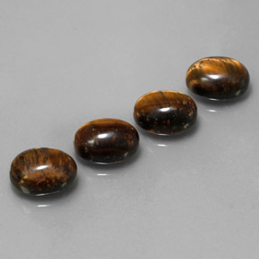 Tiger's Eye طبيعي بلون بني ذهبي، وزن ‎‎ قيراط، شكل بيضاوى، مقاس ‎9x7‎ مم