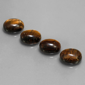 Tiger's Eye طبيعي بلون بني ذهبي، وزن ‎‎ قيراط، شكل بيضاوى، مقاس ‎9x7‎ مم
