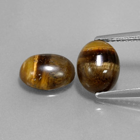 Tiger's Eye طبيعي بلون بني ذهبي، وزن ‎‎ قيراط، شكل بيضاوى، مقاس ‎8.9x6.9‎ مم