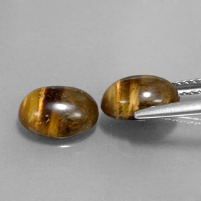 Tiger's Eye طبيعي بلون بني ذهبي، وزن ‎‎ قيراط، شكل بيضاوى، مقاس ‎8.9x6.9‎ مم