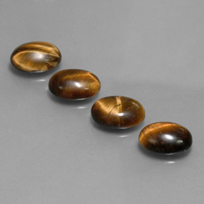 Tiger's Eye طبيعي بلون بني ذهبي، وزن ‎‎ قيراط، شكل بيضاوى، مقاس ‎8.7x6.7‎ مم