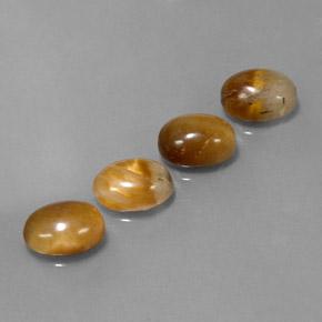 Tiger's Eye طبيعي بلون بنى دافئ، وزن ‎7.27‎ قيراط، شكل بيضاوى، مقاس ‎9x7‎ مم