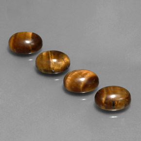 Tiger's Eye طبيعي بلون بني ذهبي، وزن ‎‎ قيراط، شكل بيضاوى، مقاس ‎8.9x7‎ مم