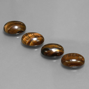 Tiger's Eye طبيعي بلون بني ذهبي، وزن ‎‎ قيراط، شكل بيضاوى، مقاس ‎8.7x6.7‎ مم