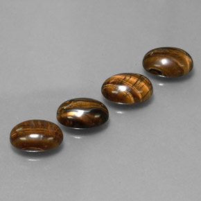 Tiger's Eye طبيعي بلون بني ذهبي، وزن ‎‎ قيراط، شكل بيضاوى، مقاس ‎8.7x6.7‎ مم