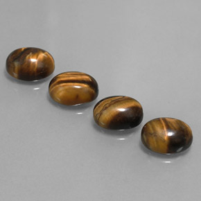 Tiger's Eye طبيعي بلون بني ذهبي، وزن ‎8.36‎ قيراط، شكل بيضاوى، مقاس ‎9x7‎ مم