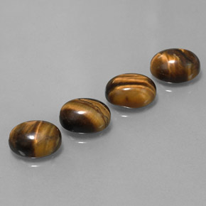 Tiger's Eye طبيعي بلون بني ذهبي، وزن ‎8.36‎ قيراط، شكل بيضاوى، مقاس ‎9x7‎ مم
