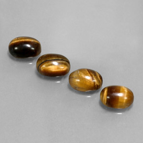 Tiger's Eye طبيعي بلون بني ذهبي، وزن ‎‎ قيراط، شكل بيضاوى، مقاس ‎8x6‎ مم