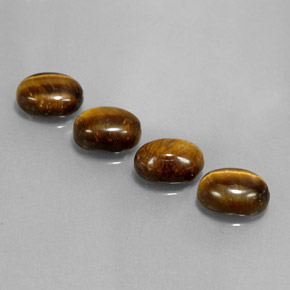 Tiger's Eye طبيعي بلون بني ذهبي، وزن ‎6.65‎ قيراط، شكل بيضاوى، مقاس ‎8.8x6.8‎ مم