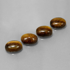 Tiger's Eye طبيعي بلون بني ذهبي، وزن ‎6.65‎ قيراط، شكل بيضاوى، مقاس ‎8.8x6.8‎ مم