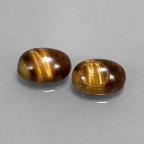 Tiger's Eye طبيعي بلون بني ذهبي، وزن ‎‎ قيراط، شكل بيضاوى، مقاس ‎8.1x6.2‎ مم