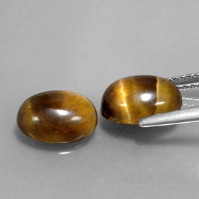 Tiger's Eye طبيعي بلون بني ذهبي، وزن ‎‎ قيراط، شكل بيضاوى، مقاس ‎9x6.9‎ مم